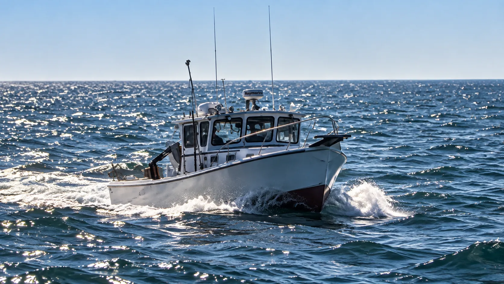 Burial-at-sea vessel underway in choppy Atlantic waters.